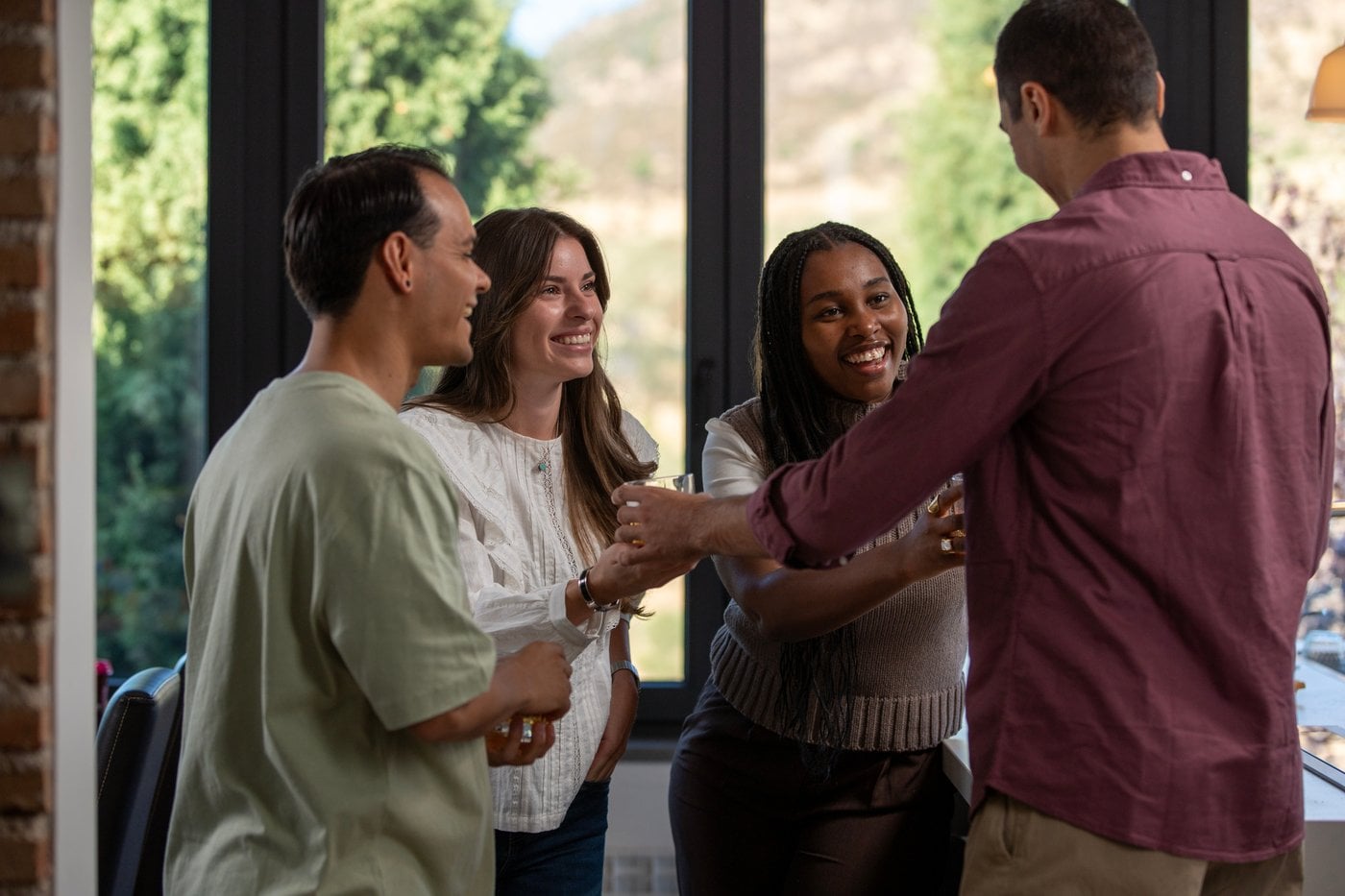 Diverse group of colleagues socialising and laughing together